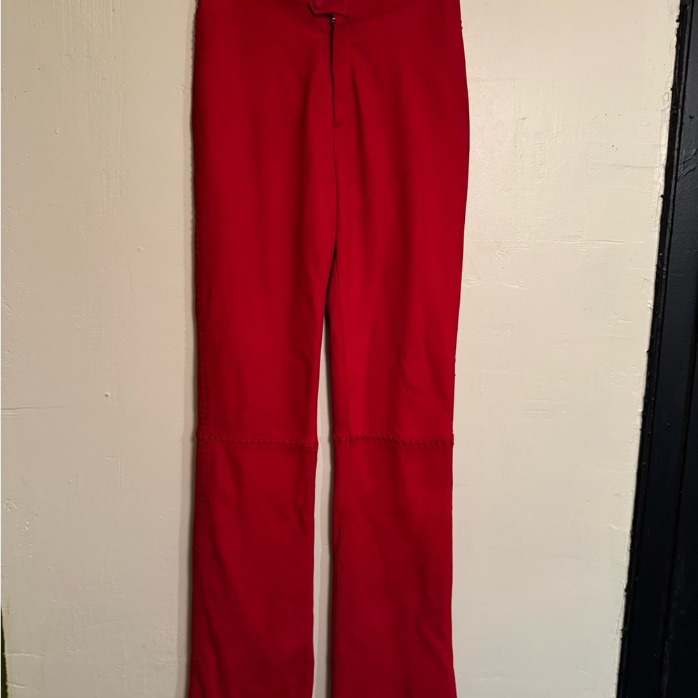 Red designer suede pants